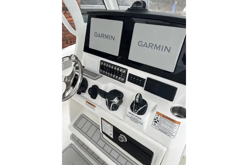 Slide: The Image of 2026 Sea Fox 288 Commander helm with dual Garmin displays and control panel. - 6