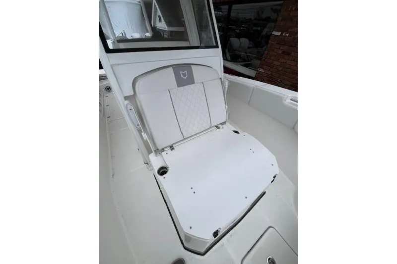 Slide: The Image of 2026 Sea Fox 288 Commander boat interior with cushioned seating and storage. - 9