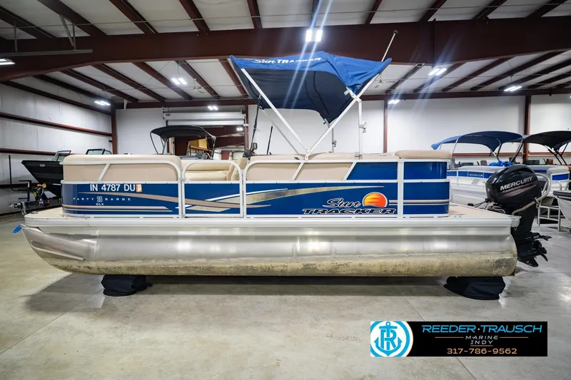 Slide: The Image of 2014 Sun Tracker Party Barge 20 DLX pontoon boat in indoor showroom. - 11