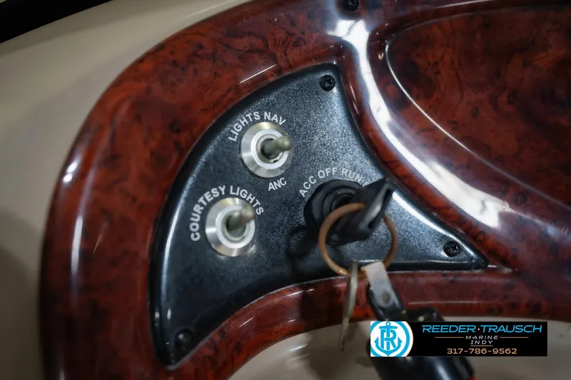 Slide: The Image of Control panel of a 2014 Sun Tracker Party Barge 20 DLX with key ignition and switches. - 31