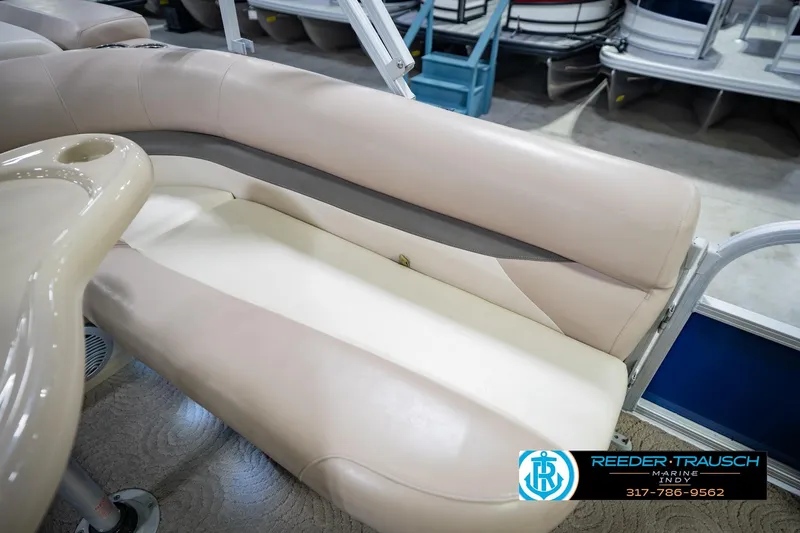 Slide: The Image of 2014 Sun Tracker Party Barge 20 DLX interior seating with beige upholstery. - 38