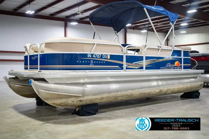 Slide: The Image of 2014 Sun Tracker Party Barge 20 DLX pontoon boat in indoor showroom. - 4