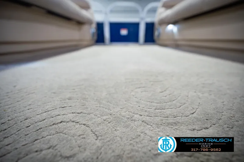 Slide: The Image of 2014 Sun Tracker Party Barge 20 DLX interior carpet, showcasing plush texture and spacious layout. - 43