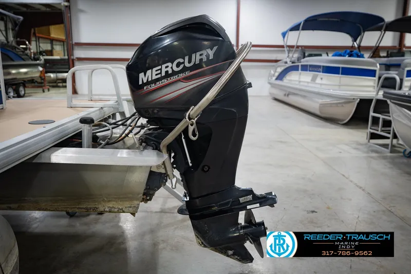 Slide: The Image of 2014 Sun Tracker Party Barge 20 DLX with Mercury FourStroke outboard motor in showroom. - 44