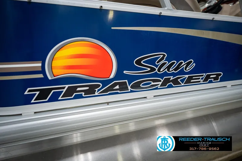 Slide: The Image of 2014 Sun Tracker Party Barge 20 DLX logo on blue background, Reeder-Trausch Marine branding. - 48