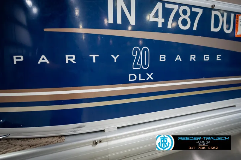 Slide: The Image of 2014 Sun Tracker Party Barge 20 DLX boat signage with dealership logo. - 49
