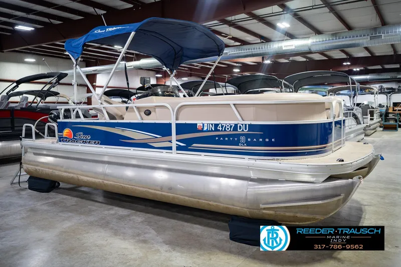 Slide: The Image of 2014 Sun Tracker Party Barge 20 DLX pontoon boat in indoor showroom. - 6