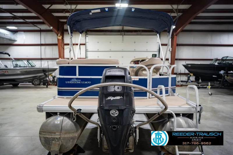 Slide: The Image of 2014 Sun Tracker Party Barge 20 DLX pontoon boat in indoor showroom. - 9