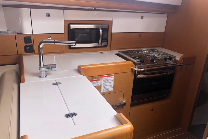 Slide: The Image of Modern kitchen in 2017 Jeanneau Sun Odyssey 41 DS yacht with stove and microwave. - 12
