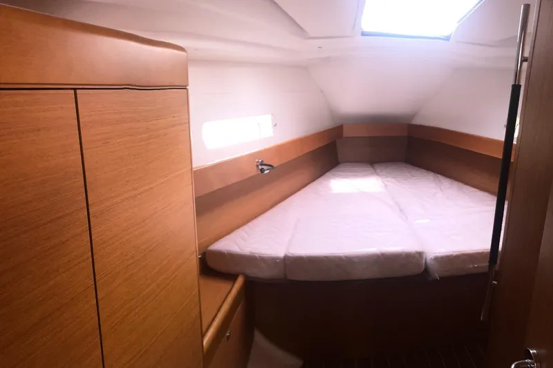Slide: The Image of Interior cabin of 2017 Jeanneau Sun Odyssey 41 DS with wooden finish and bed. - 13