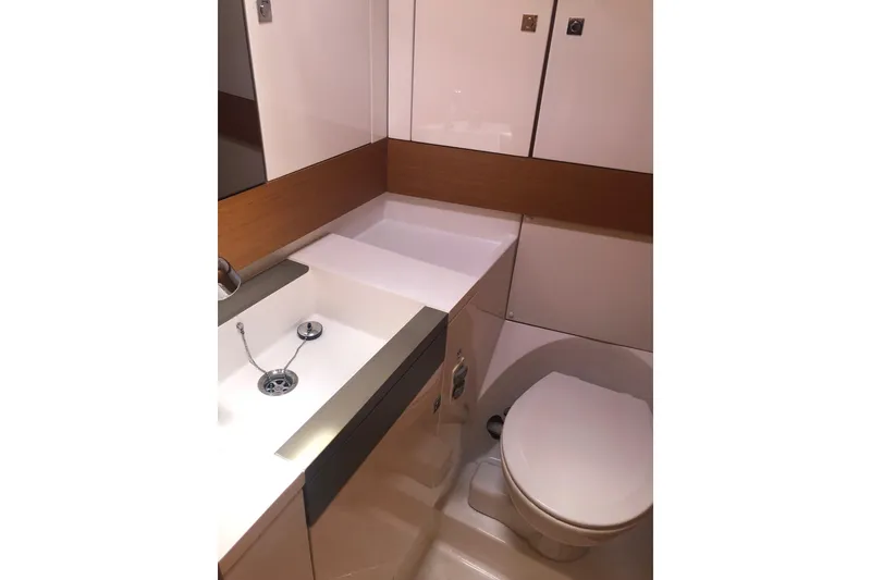 Slide: The Image of Modern bathroom in 2017 Jeanneau Sun Odyssey 41 DS yacht, featuring sleek sink and toilet. - 14