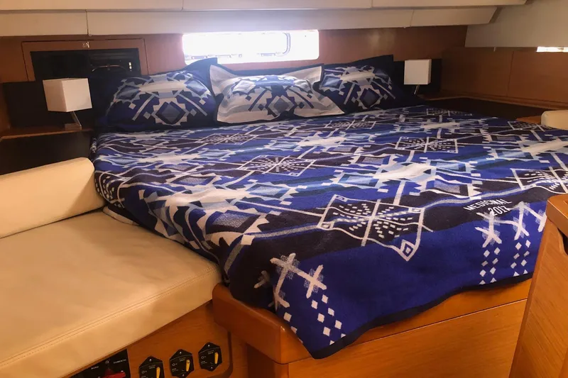 Slide: The Image of Cozy cabin interior of 2017 Jeanneau Sun Odyssey 41 DS with patterned bedding. - 15