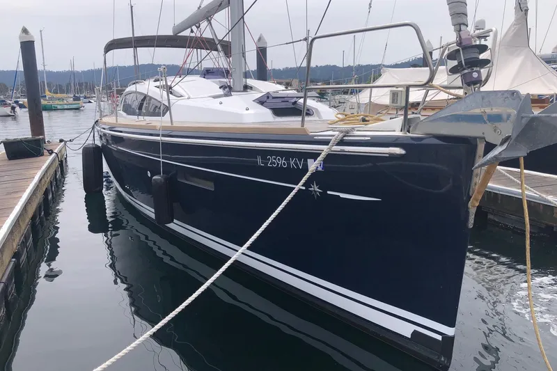Slide: The Image of 2017 Jeanneau Sun Odyssey 41 DS sailboat docked in a marina, side view. - 2