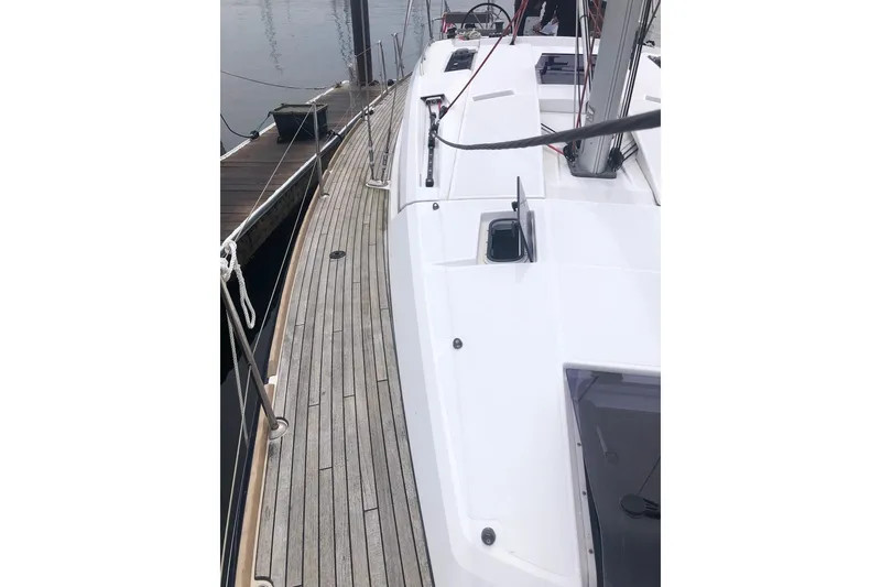 Slide: The Image of 2017 Jeanneau Sun Odyssey 41 DS sailboat docked, showcasing sleek deck design. - 20