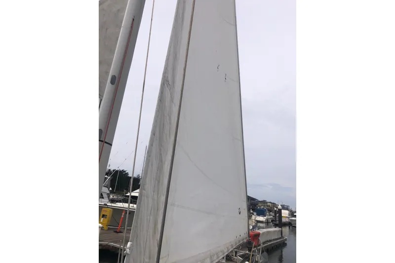 Slide: The Image of Sail of a 2017 Jeanneau Sun Odyssey 41 DS docked at a marina. - 25