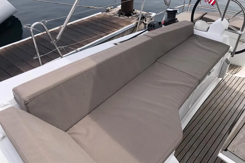Slide: The Image of 2017 Jeanneau Sun Odyssey 41 DS yacht with cushioned seating on deck. - 33
