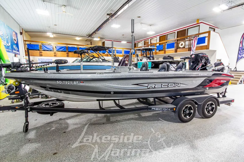 The Image of 2019 Recon 2185 SC boat displayed indoors on a trailer. - 1