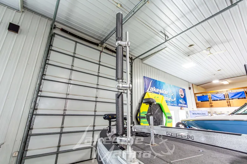 Slide: The Image of 2019 Recon 2185 SC boat in showroom with fishing equipment. - 11