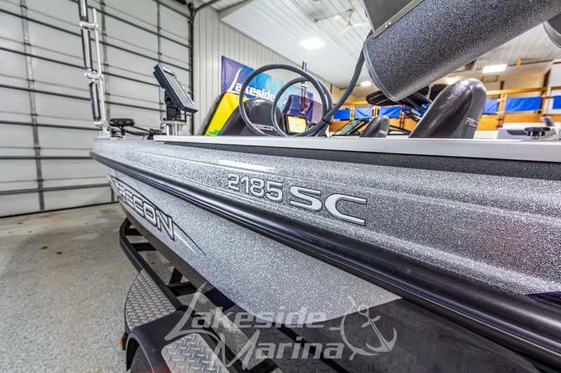 Slide: The Image of 2019 Recon 2185 SC boat displayed at Lakeside Marina showroom. - 12