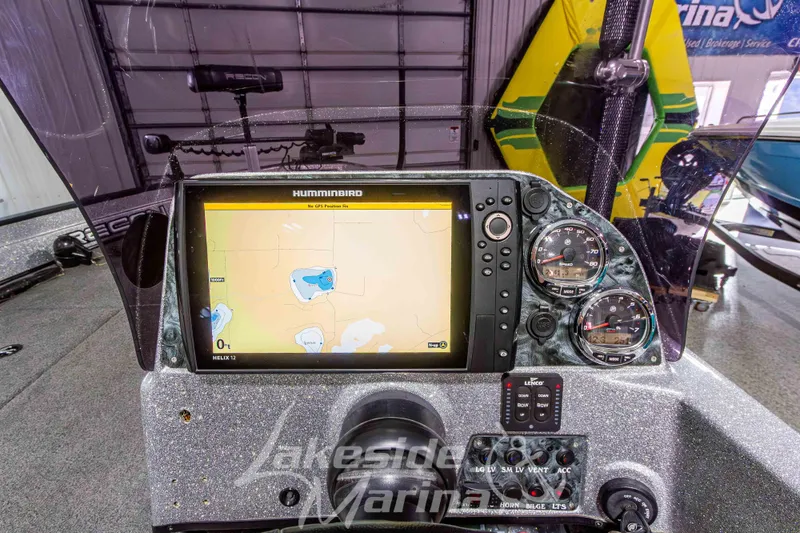 Slide: The Image of Dashboard of a 2019 Recon 2185 SC boat with navigation system and gauges. - 21