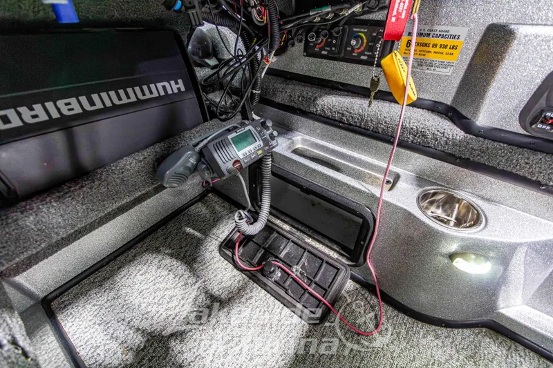 Slide: The Image of Interior of a 2019 Recon 2185 SC boat with electronic equipment and control panel. - 23