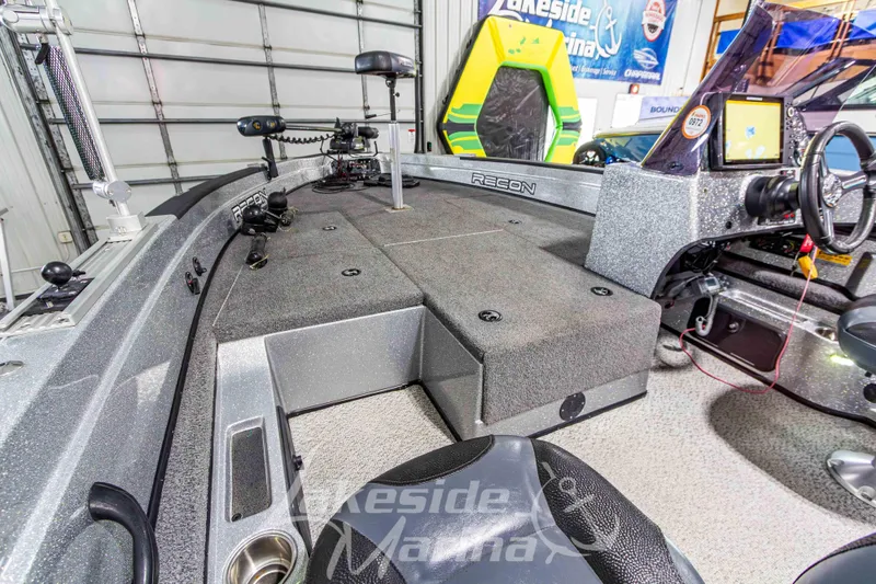 Slide: The Image of 2019 Recon 2185 SC fishing boat interior with steering wheel and control panel. - 24