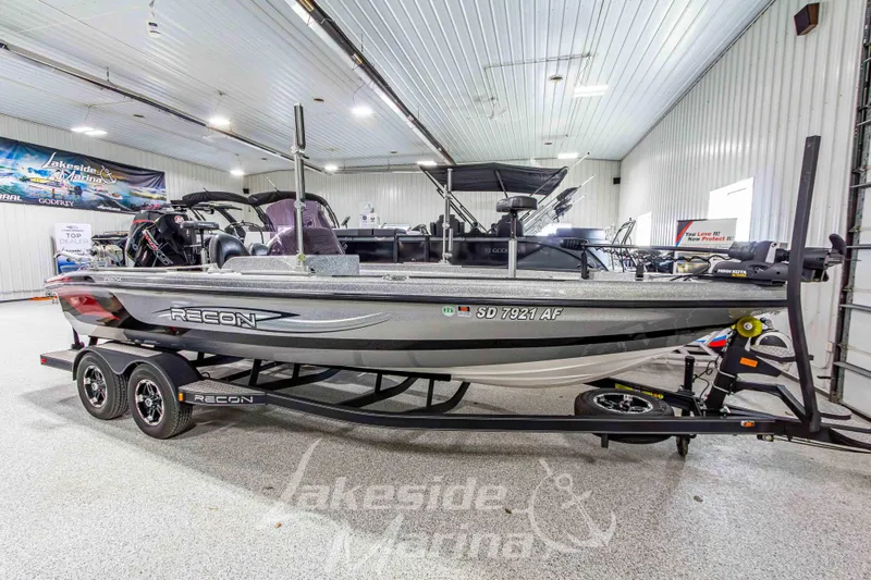 Slide: The Image of 2019 Recon 2185 SC boat displayed indoors at Lakeside Marina. - 7