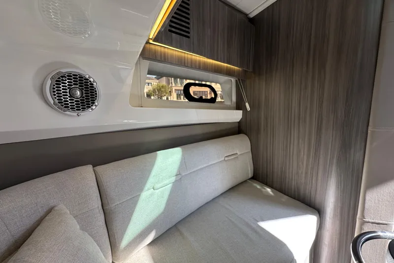 Slide: The Image of Interior cabin of 2018 Sea Ray SLX 400 with modern seating and speaker. - 2