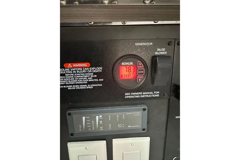 Slide: The Image of Control panel of a 2018 Sea Ray SLX 400 boat, featuring generator and bilge blower. - 25