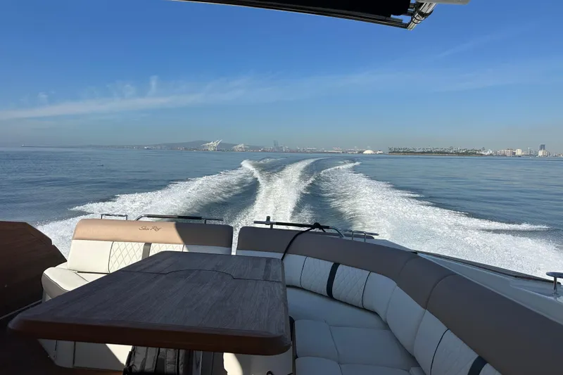 Slide: The Image of 2018 Sea Ray SLX 400 cruising on open water, leaving a wake behind. - 27