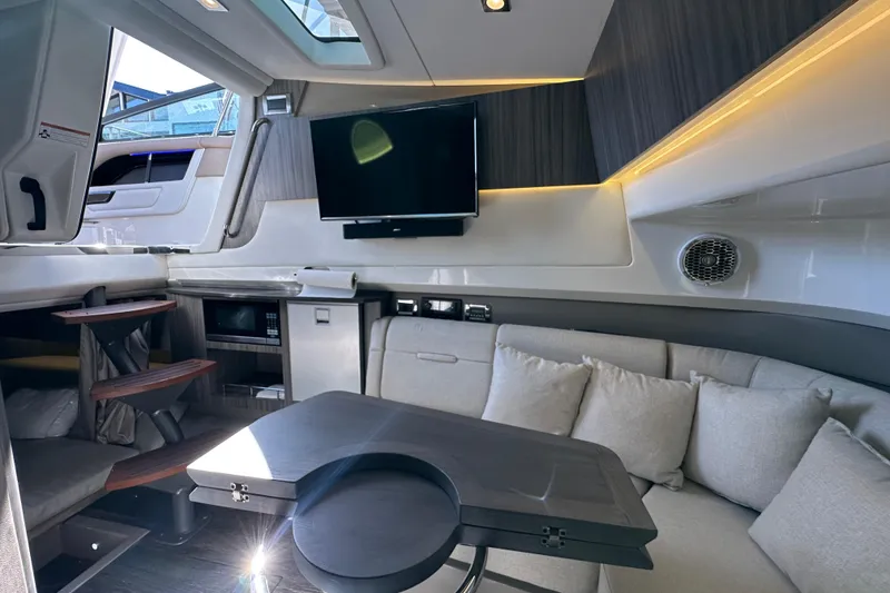 Slide: The Image of Luxurious interior of 2018 Sea Ray SLX 400 yacht with modern amenities and comfortable seating. - 3