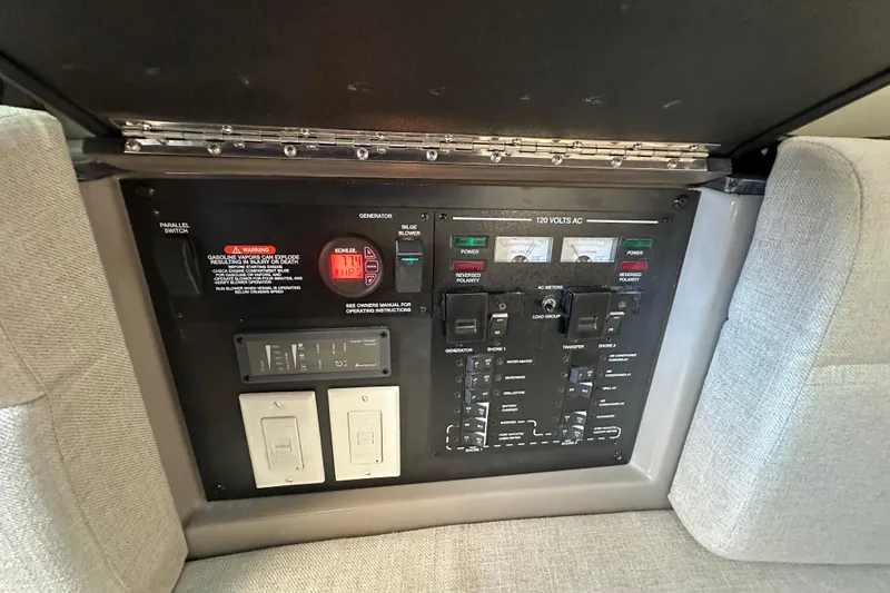 Slide: The Image of Electrical control panel of a 2018 Sea Ray SLX 400 boat, featuring various switches and meters. - 31