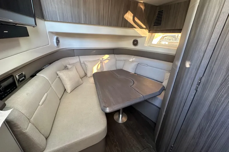 Slide: The Image of Luxurious interior of 2018 Sea Ray SLX 400 yacht with cozy seating and elegant table. - 34