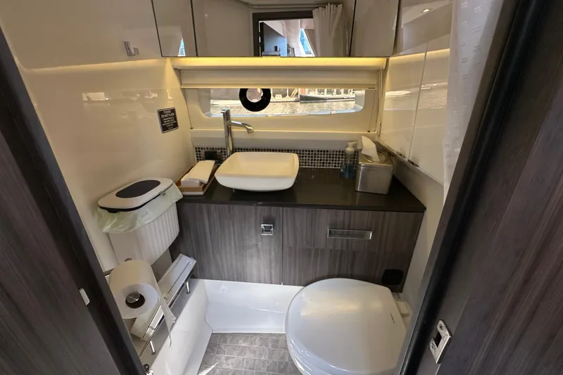 Slide: The Image of Luxurious bathroom interior of 2018 Sea Ray SLX 400 yacht with modern amenities. - 9