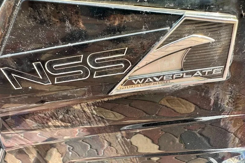 Slide: The Image of Close-up of 2018 Nautique Super Air Nautique GS22 NSS Waveplate logo. - 13