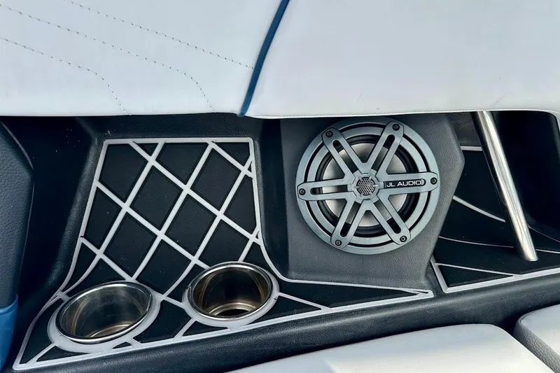 Slide: The Image of 2018 Nautique Super Air Nautique GS22 interior with JL Audio speaker and cup holders. - 30