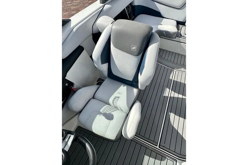 Slide: The Image of 2018 Nautique Super Air Nautique GS22 interior with gray and black seating. - 35
