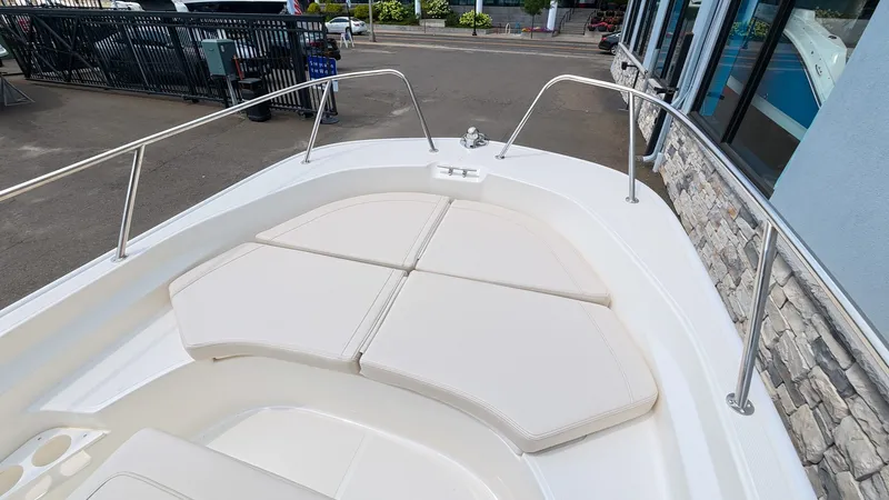 Slide: The Image of The image shows the bow of a Boston Whaler 170 Montauk with cushioned seating. - 23
