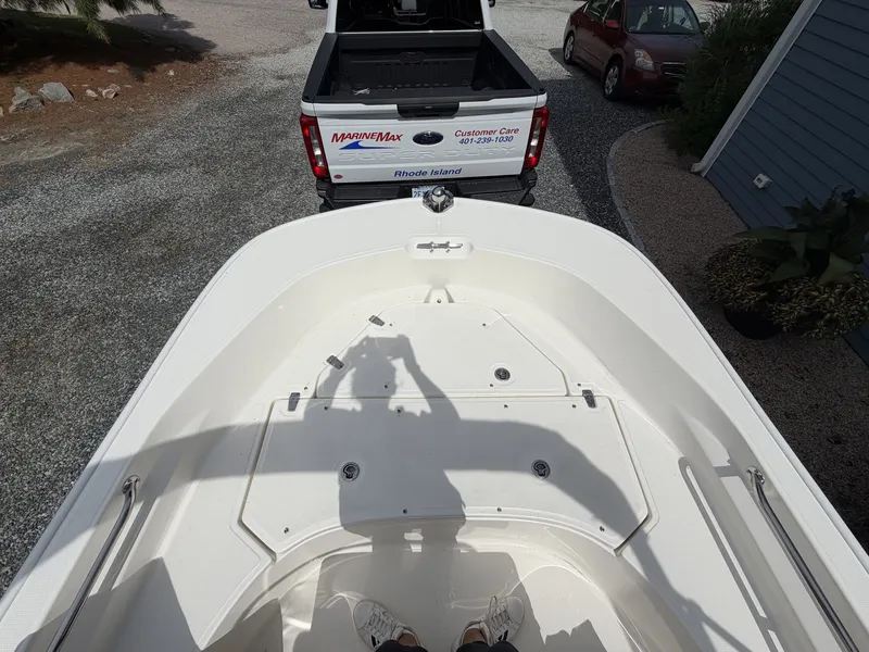 Slide: The Image of View from a boat looking at a pickup truck with a boat trailer on a gravel driveway. - 15