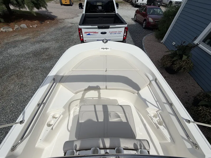 Slide: The Image of The image shows the deck of a 2027 Boston Whaler 170 Montauk, parked on a trailer. - 12
