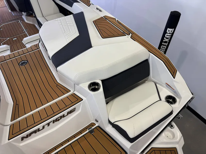 Slide: The Image of 2023 Nautique Super Air Nautique G23 boat interior with luxurious seating. - 11