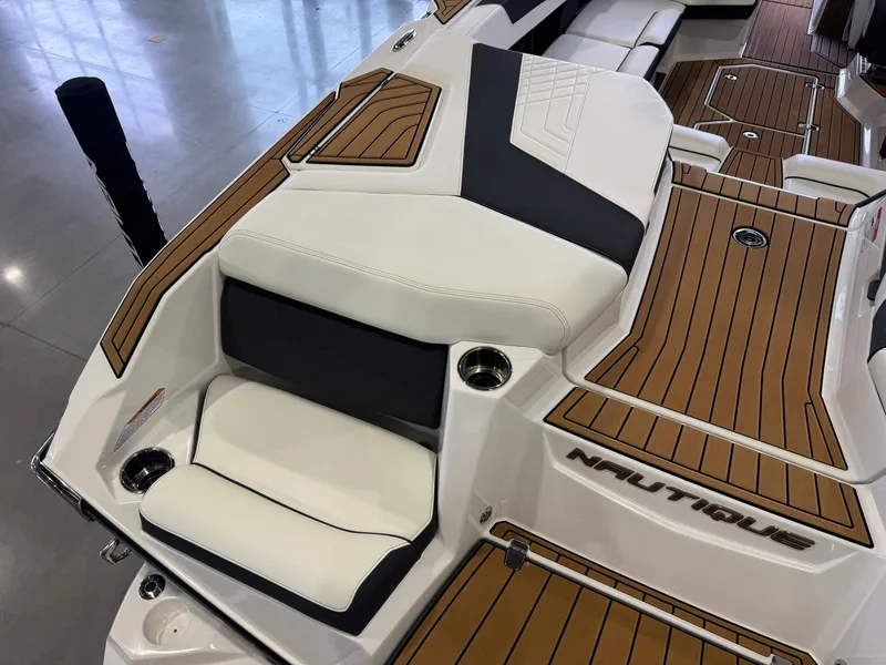 Slide: The Image of 2023 Nautique Super Air Nautique G23 boat interior with wood finish. - 12