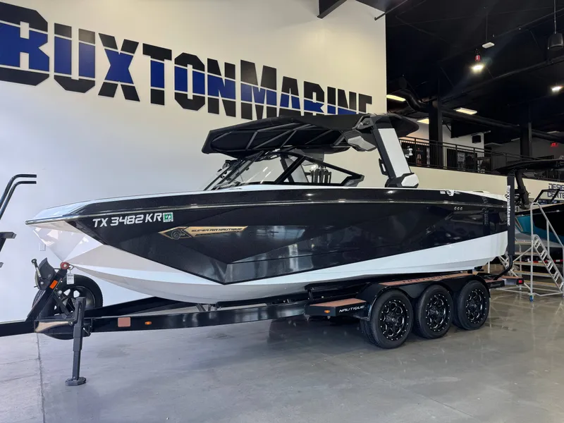 Slide: The Image of 2023 Nautique Super Air Nautique G23 boat in showroom. - 3