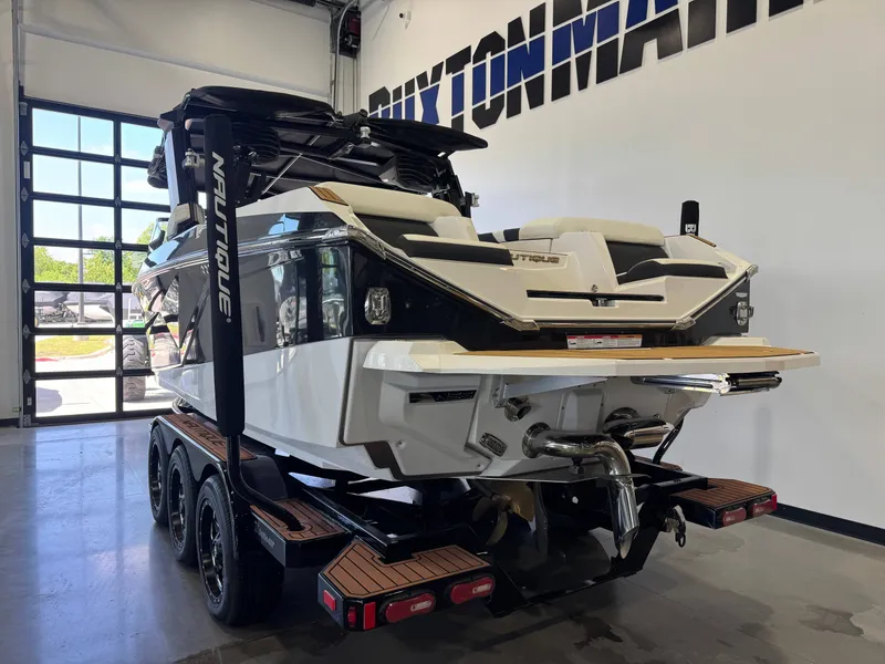 Slide: The Image of 2023 Nautique Super Air Nautique G23 boat in showroom. - 5