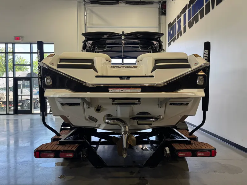 Slide: The Image of Rear view of 2023 Nautique Super Air Nautique G23 boat in showroom. - 6