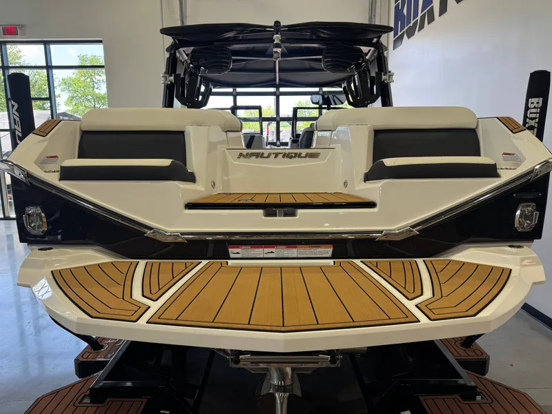 Slide: The Image of Rear view of 2023 Nautique Super Air Nautique G23 boat in showroom. - 8