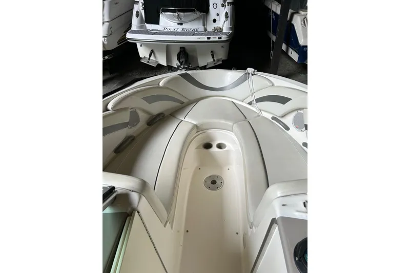 Slide: The Image of 2005 Maxum 2200 SR3 boat interior with seating and cup holders. - 11