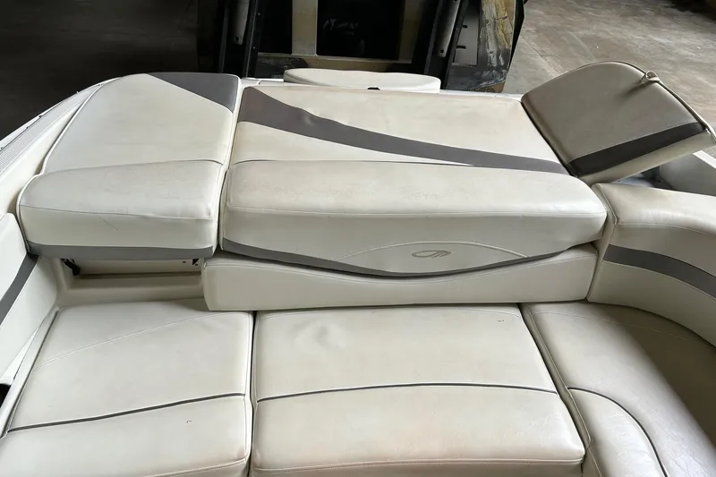 Slide: The Image of 2005 Maxum 2200 SR3 boat interior with white cushioned seating. - 12