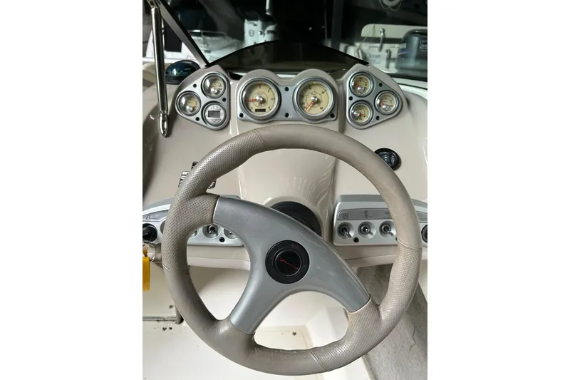Slide: The Image of Steering wheel and dashboard of a 2005 Maxum 2200 SR3 boat. - 14