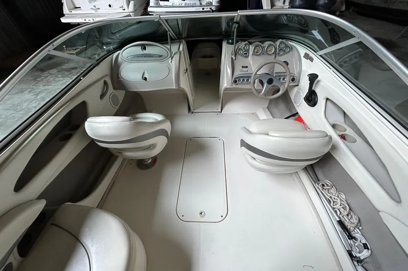 Slide: The Image of 2005 Maxum 2200 SR3 boat interior with steering wheel and seating. - 16